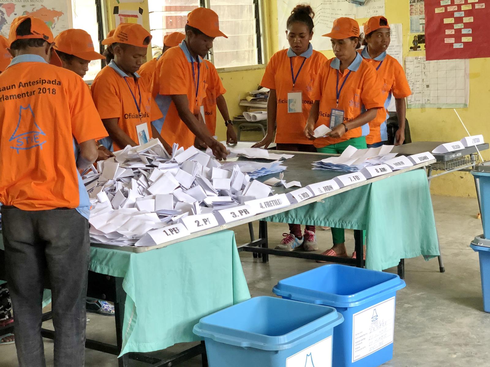 The Technical Secretariat for Electoral Administration (STAE) sorts ballots during the 2018 Timor-Leste parliamentary elections.