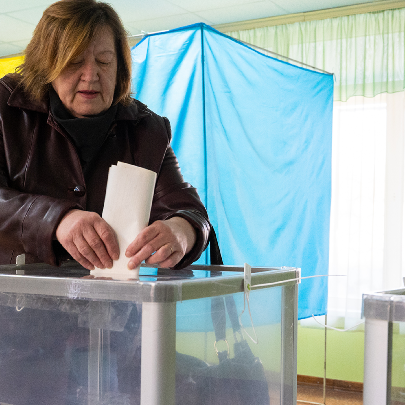 A voter casts her ballot during the first-round presidential election on March 31.