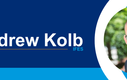 Graphic displaying dark blue, light blue, white and gold elements with white text reading &quot;Andrew Kolb, IFES&quot; and a headshot of a man on the far right.
