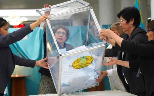 Members of an election commission remove ballots from a box to count them at a polling station after the Nationwide Referendum in Nur-Sultan, Kazakhstan.