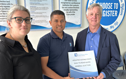 IFES Asia-Pacific Regional Director Melika Atic, Fiji Electoral Commission Supervisor of Elections Mohammed Saneem, and IFES President Tony Banbury pose together.