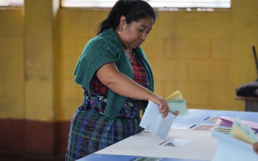A woman votes during general elections in Sumpango, Guatemala, Sunday, March 25, 2023. (AP Photo/Moises Castillo)
