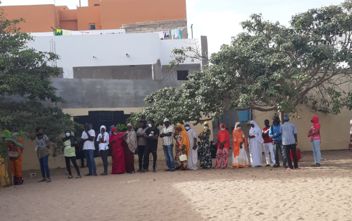 Voters stand in line waiting their turn to vote in the 2022 Senegalese local elections