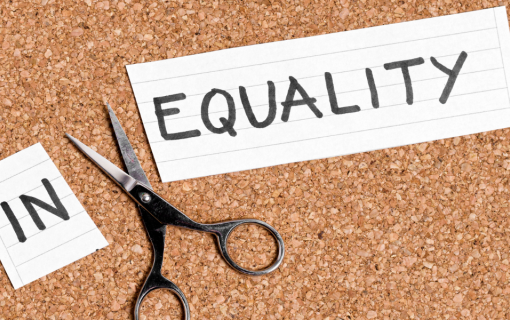 Photo Credit Viorela Florescu via Getty Images for Canva Pro A piece of paper with the word &quot;EQUALITY&quot; written on it pinned to a cork board, with scissors and another piece of paper with the word &quot;IN&quot; beside it.
