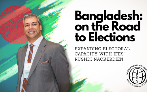 Rushdi Nackerdien standing by the text "Bangladesh: on the Road to Elections"