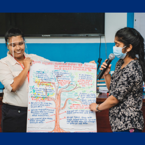 Two young women with disabilities participate in a training activity in Sri Lanka.