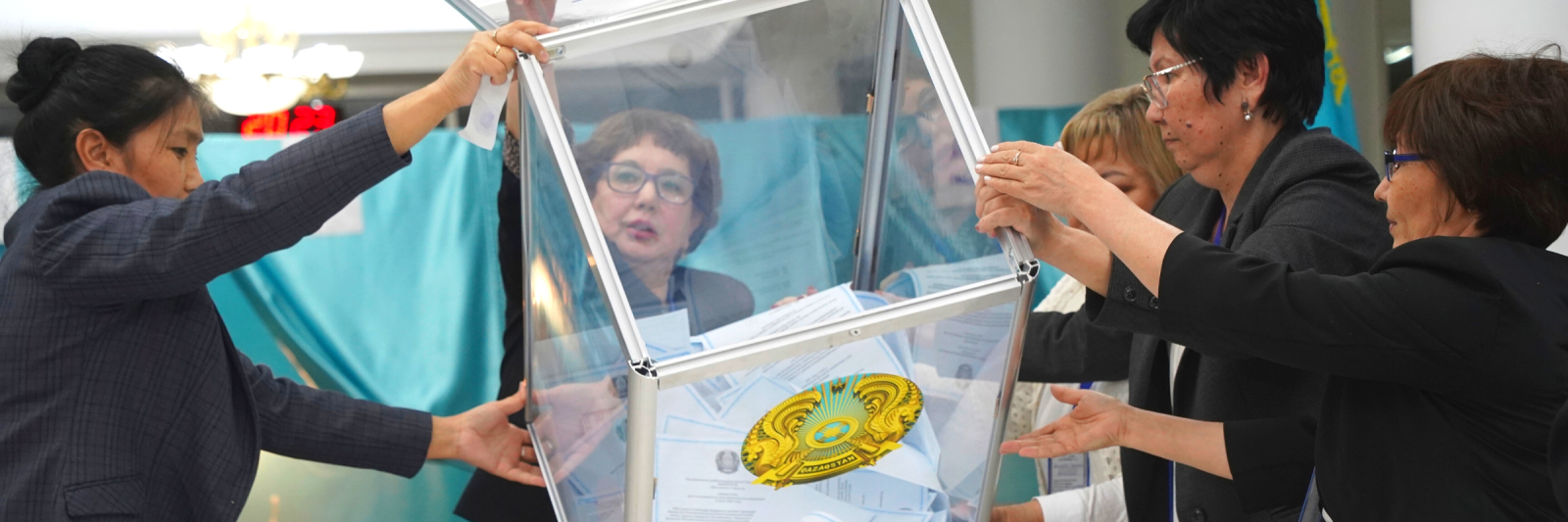 Members of an election commission remove ballots from a box to count them at a polling station after the Nationwide Referendum in Nur-Sultan, Kazakhstan.