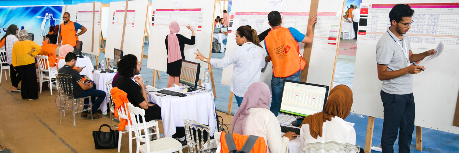 Members of the Independent Higher Authority for Elections count the votes one day after the constitutional referendum in Tunis.