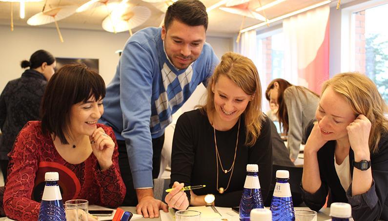 People around a table participating in cyber hygiene course in Estonia.