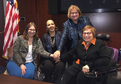 IFES Inclusion Advisor Virginia Atkinson and panelists Charlotte McClain-Nhlapo, Isabel Hodge and Judith Heumann pose together.