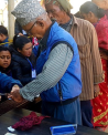 Voters queue to receive their ballots and have their fingers marked with indelible ink in Bhaktapur