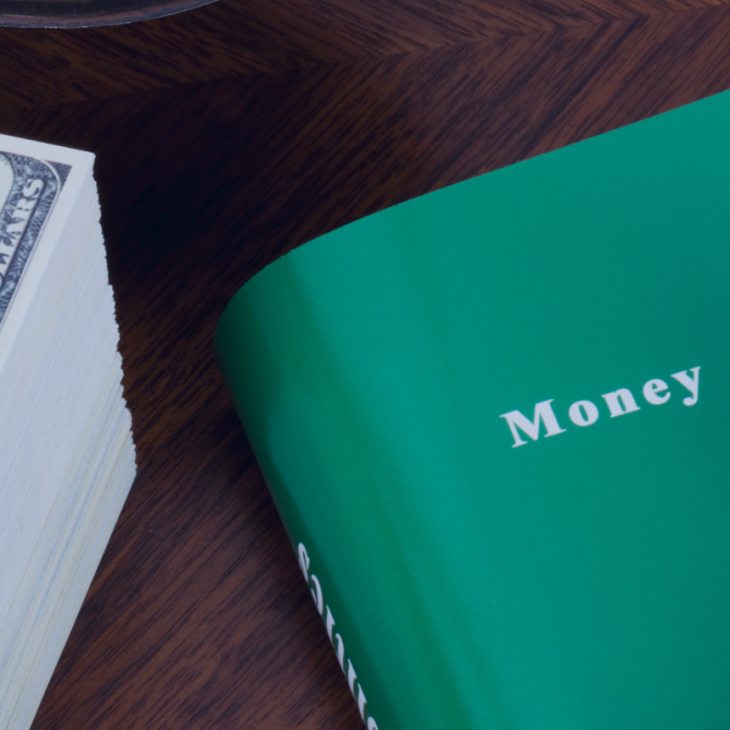 Book money and politics with gavel on top next to a stack of money on a desk. photo credit ericsphotography via canva pro