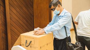 Voter in Sri Lanka using braile ballot
