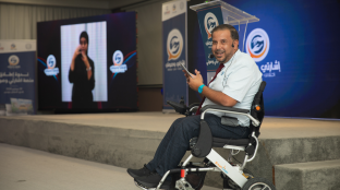 Imed, a Tunisian advocate for the rights of persons with disabilities, moderating the launch event.