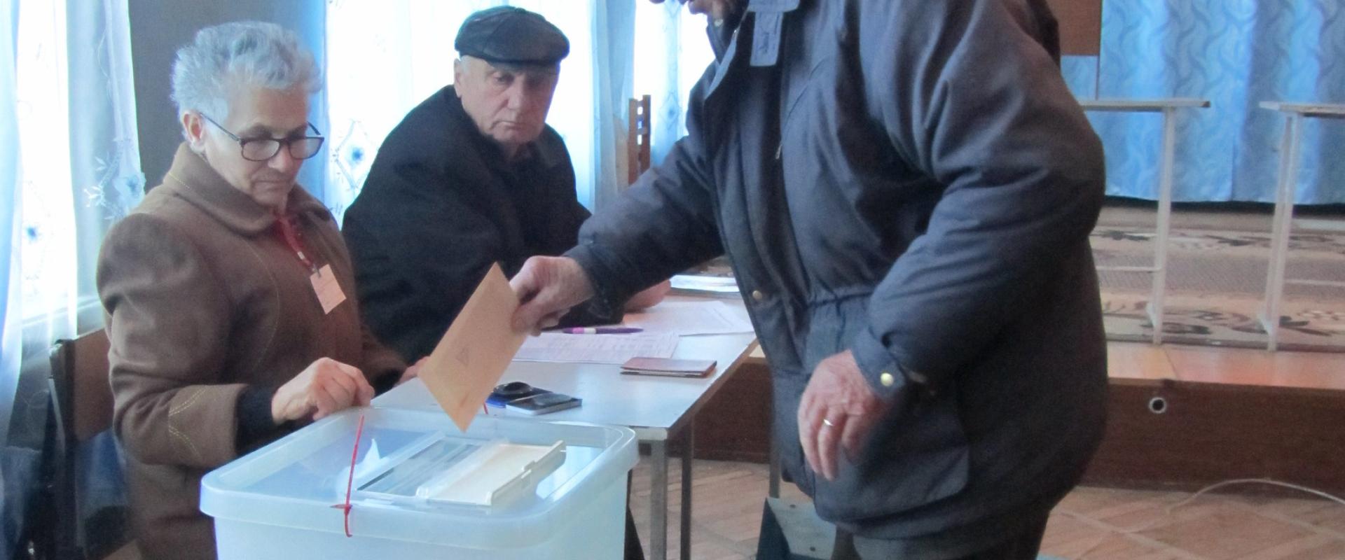 Man casting ballot in Armenia