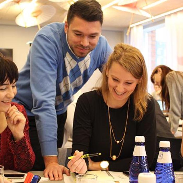 People at a table taking part in cyber hygiene course in Estonia