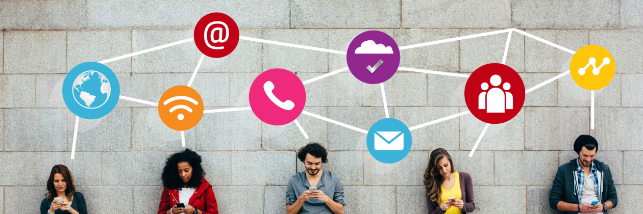 a group of people holding their phones while standing against the wall with digital icons above their heads.