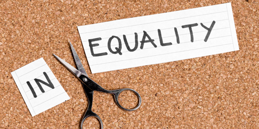 Photo Credit Viorela Florescu via Getty Images for Canva Pro A piece of paper with the word "EQUALITY" written on it pinned to a cork board, with scissors and another piece of paper with the word "IN" beside it.