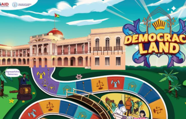 Democracy Land the game photo, USAID & IFES logo in top right corner